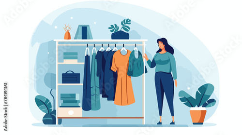 Woman standing at open wardrobe and choosing clothe