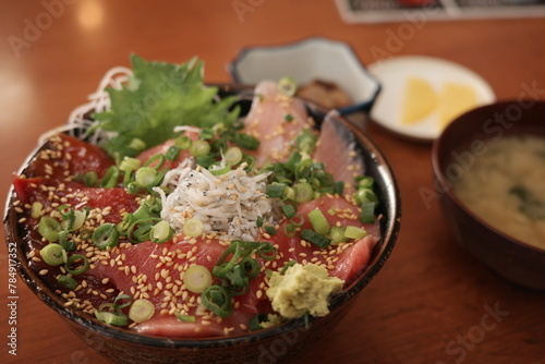 Bowl of rice topped with sashimi