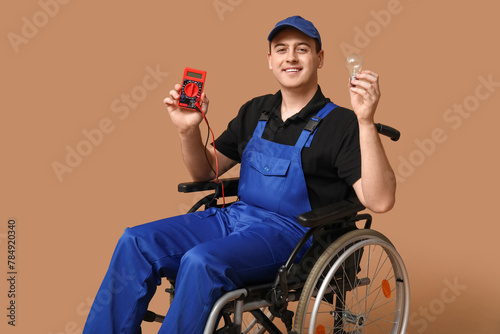 Male electrician in wheelch...