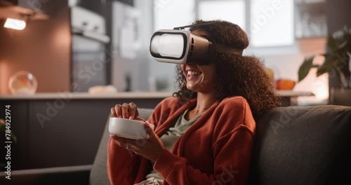 Digital, woman and virtual reality in house, snack or futuristic tech for online streaming with vr goggles. Movie, comedy with gadget in 3d, interactive or internet experience for entertainment