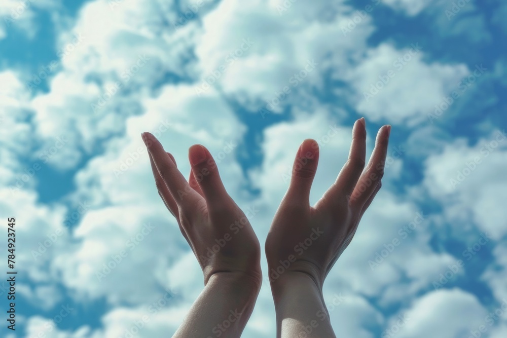 Hands to heaven, person with arms raised hands up looking at the sky Hands to heaven, person with arms raised hands up looking at the sky