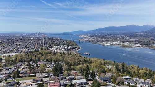 Fotografie Skyline of Burnaby, Vancouver, and the Burrard Inlet in the Lower Mainland durin