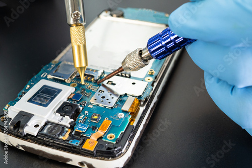 Repairing and upgrade Samsung mobile phone, electronic, computer hardware and technology concept.