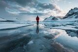 A traveler stands on an ice sheet in Iceland, surrounded by snowy mountains and reflecting the sky. Ai generated