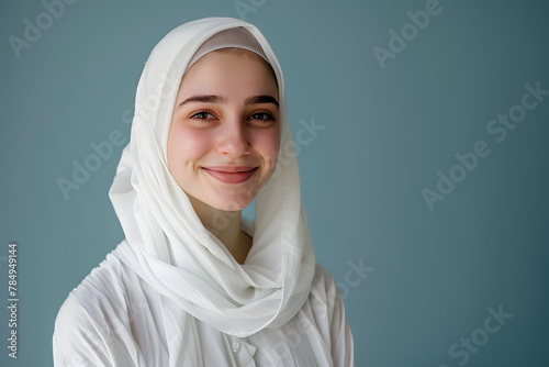 Portrait of beautiful young muslim woman with white hijab