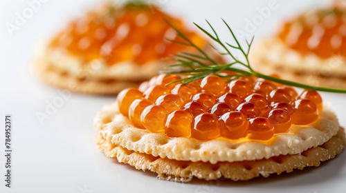  Canapés with salmon caviar and dill, an elegant appetizer for fine dining.