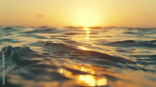 Golden hour, calm sea, close-up, straight-on shot, sun kissing ocean, tranquil beauty  © Thanthara
