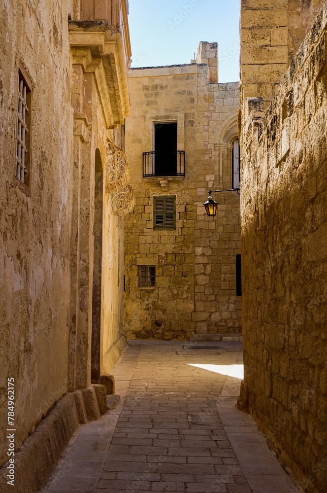 Empty narrow street in a summer morning in Mdina, Malta