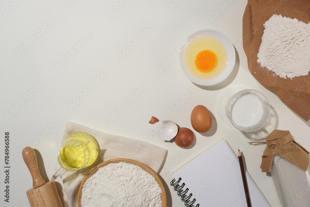 Copy space photo with many essential baking cake ingredients flat lay on white kitchen counter top, available photo whether you advertising bread, brownies, cookies, cakes or tarts. Copy space photo with many essential baking cake ingredients flat lay on white kitchen counter top, available photo whether you advertising bread, brownies, cookies, cakes or tarts.