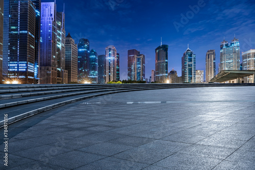 City square floor and modern commercial building scenery at night in Shanghai. Famous financial district buildings in Shanghai.
