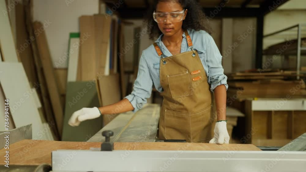 Professional carpenter or woodworker or charpentier woman bring wooden planks and set to fit with the other tools to prepare for wood work in workplace.