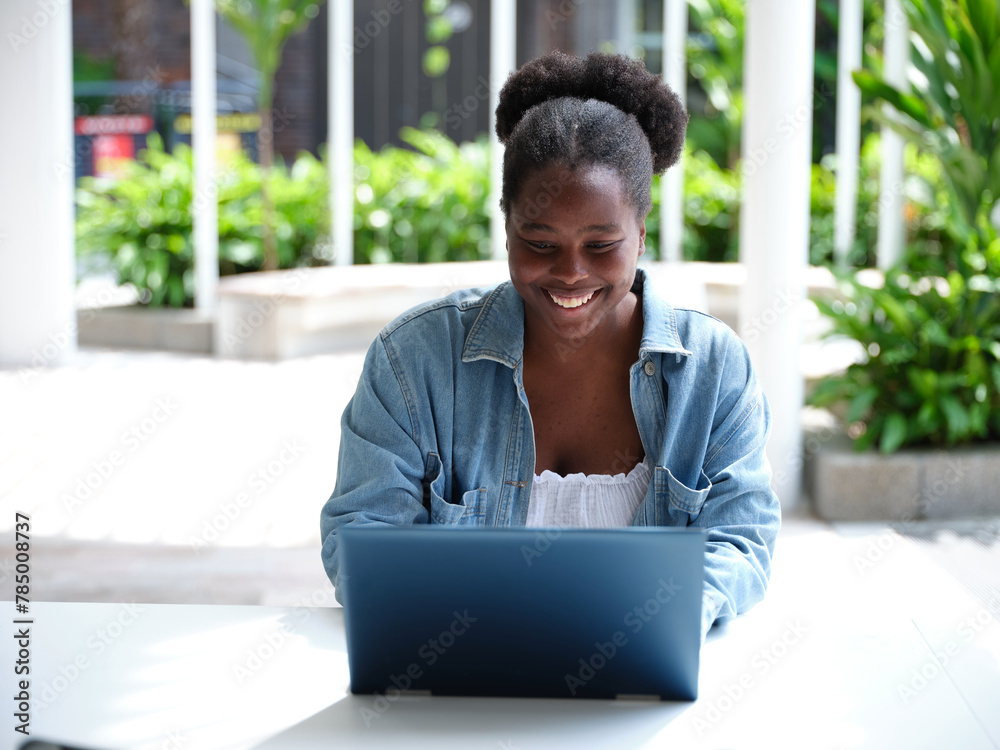 Young African woman using a computer on university campus Young African woman using a computer on university campus