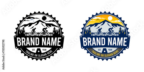 The emblem illustration logo features a gear-shaped design with a fusion of elements, including a cyclist, a majestic mountain peak, and pine trees. 