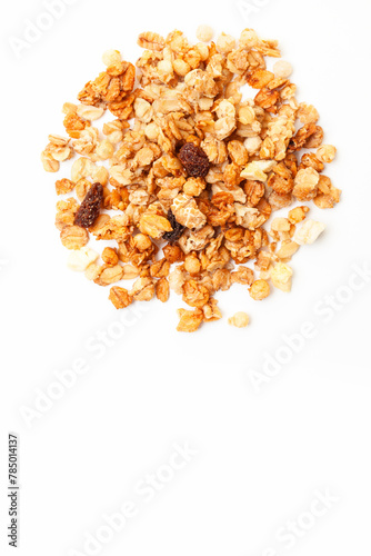 Pile of Muesli oat cereals with raisins, dried fruits and sunflower seeds on white background. Top view. Space for a text
