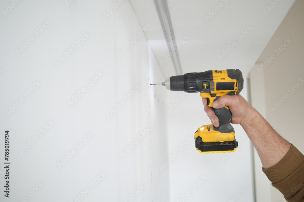 slow motion of using electric drilling on white wooden board slow motion of using electric drilling on white wooden board