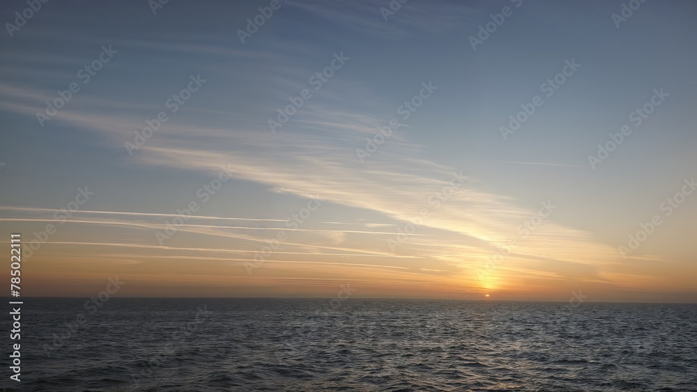 Sun rising above Red sea at spring. Seascape with the horizon of the sea.