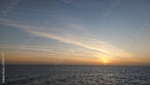 Sun rising above Red sea at spring. Seascape with the horizon of the sea.