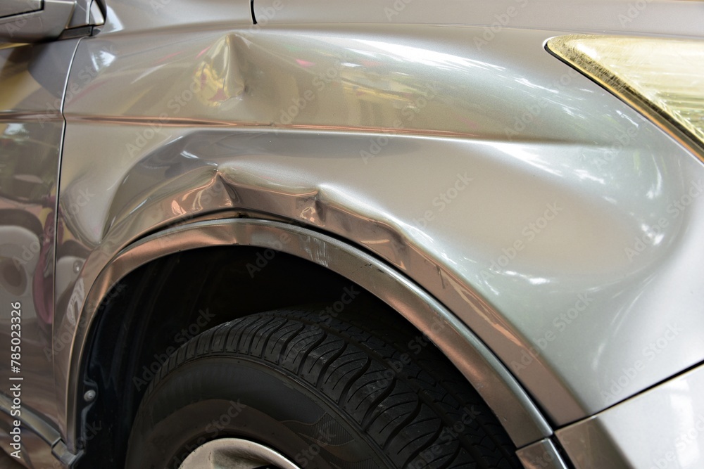dented on car front fender crash by motorcycle. dented on car front fender crash by motorcycle.