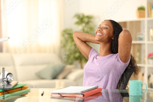 Relaxed black student resting at home