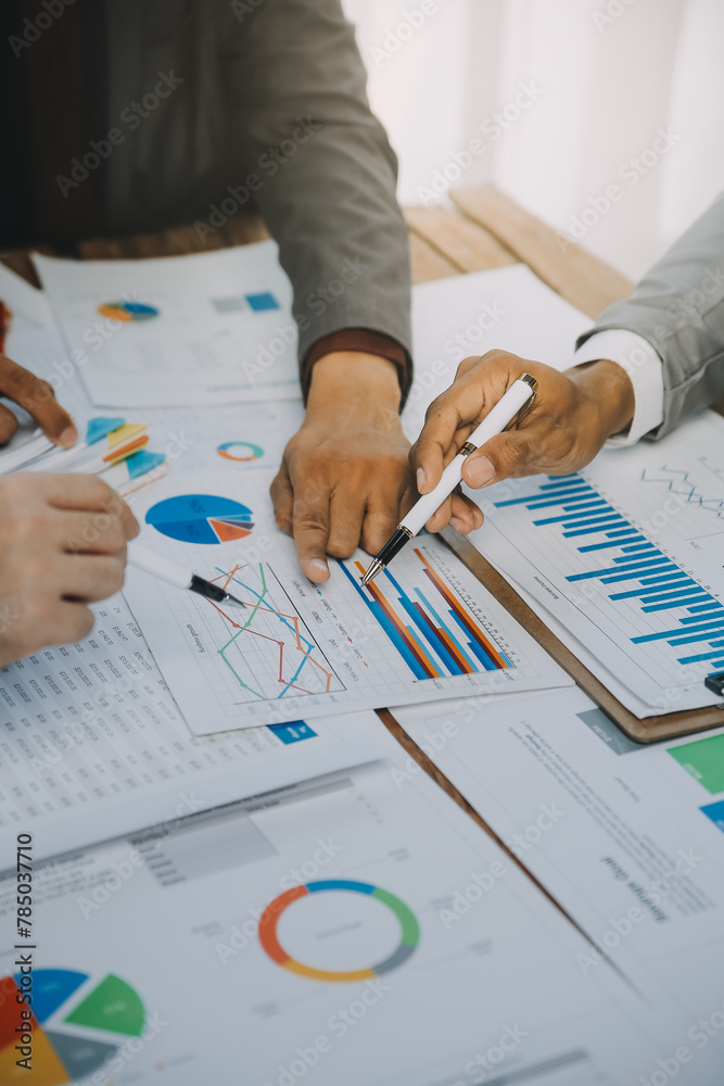 Business idea. Business people talking And calculations about charts and graphs showing the growth of investment results Of successful teamwork