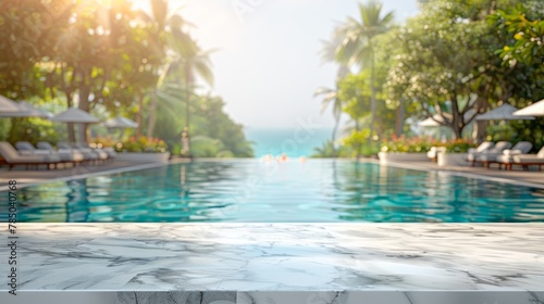 Empty white marble stone table top and blurred swimming pool in tropical resort in summer banner background © Wanlop