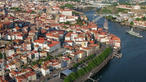 Porto, Portugal - Sunset aerial flyover above the Douro river and the city of Porto photo