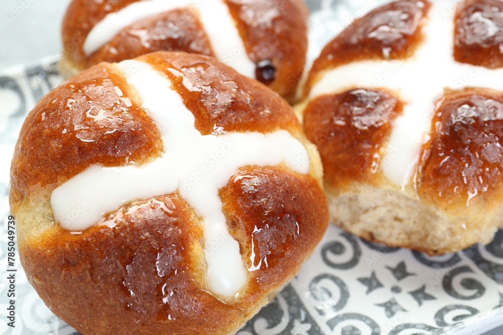 Tasty hot cross buns on table, closeup Tasty hot cross buns on table, closeup