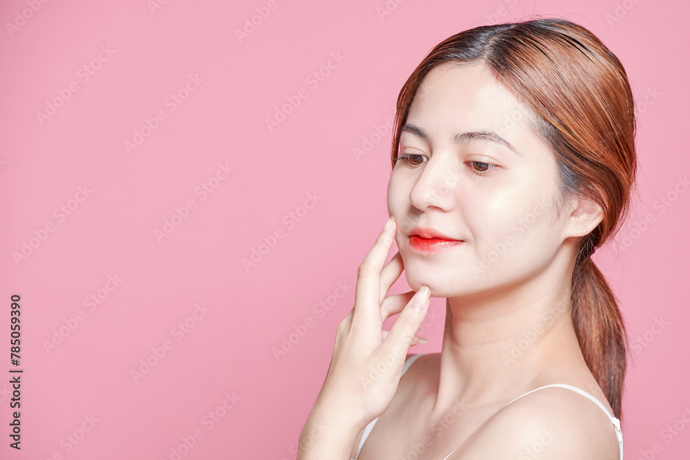 Beauty asian woman face portrait. beautiful model girl with perfect fresh clean skin color lips red. Facial treatment. Face care, Cosmetology , beauty and spa. Isolated on pink background. Beauty asian woman face portrait. beautiful model girl with perfect fresh clean skin color lips red. Facial treatment. Face care, Cosmetology , beauty and spa. Isolated on pink background.