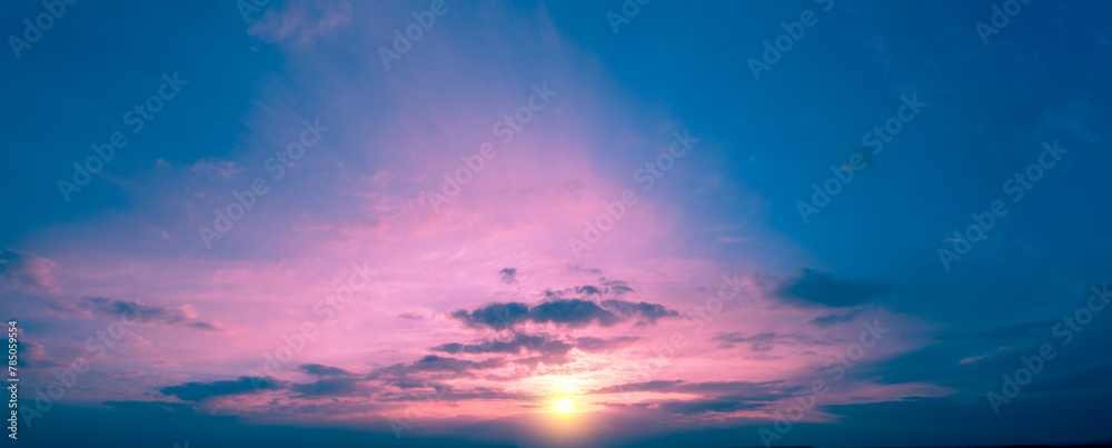 Colorful cloudy sky at sunset. Sky texture. Abstract nature background. Horizontal banner