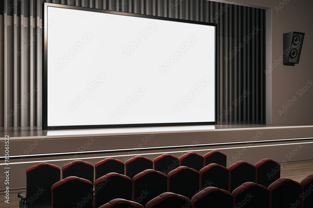 Obraz premium Modern cinema hall with comfortable red seats facing a large blank screen. 3D Rendering