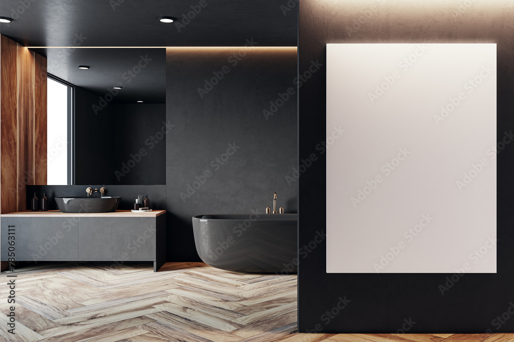 Naklejka premium Modern bathroom with black freestanding tub, contrasting wooden accents and blank poster mockup. 3D Rendering