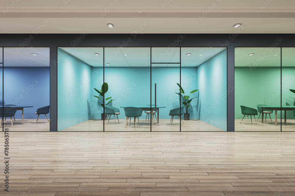 Obraz premium Modern office interior with glass walls, a wooden floor, and furniture, illuminated by light, concept of workspace design. 3D Rendering