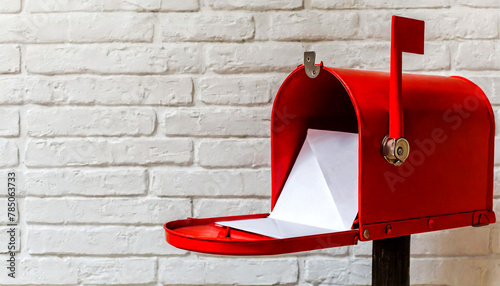 Close-up of an open red letter box with white envelopes against a white brick wall with copy space. Generative Ai. photo