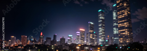 Abstract night lights of a modern futuristic cityscape. Defocused image  view of a dark modern urban skyline in the evening glow with many tall buildings  towers  skyscrapers with glowing windows.
