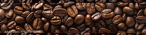 wallpaper of coffee beans  seamless pattern. Numerous brown  perfectly shaped and detailed coffee beans arranged in neat rows.