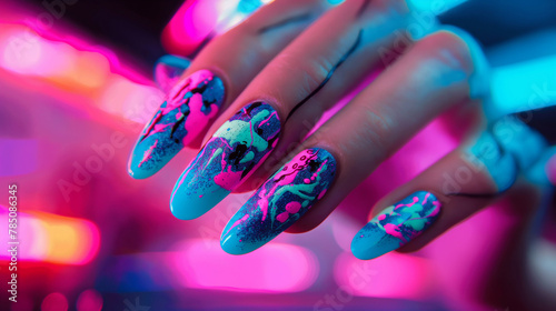 Close-up nail art with neon nightlife theme, vibrant pink and blue, cityscape designs, Glamour woman hand with nail polish on her fingernails. Nail art and design.