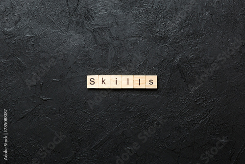 Skills word written on wood block. Skills text on cement table for your desing, concept