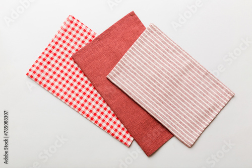 top view with red empty kitchen napkin isolated on table background. Folded cloth for mockup with copy space, Flat lay. Minimal style © sosiukin