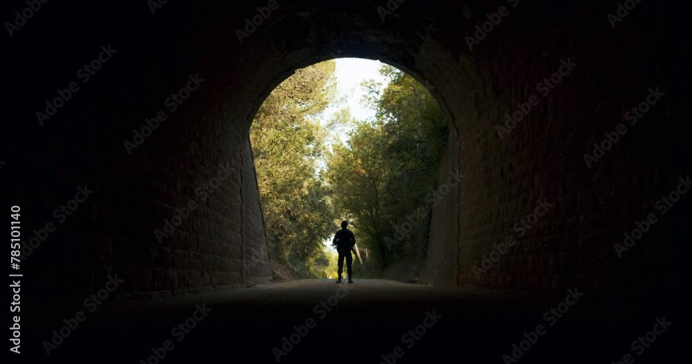 Light at the End of the Tunnel with an Armed Guard