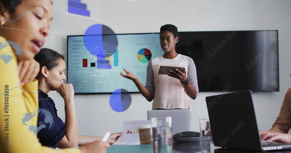 Image of data processing over diverse business people talking in office Image of data processing over diverse business people talking in office
