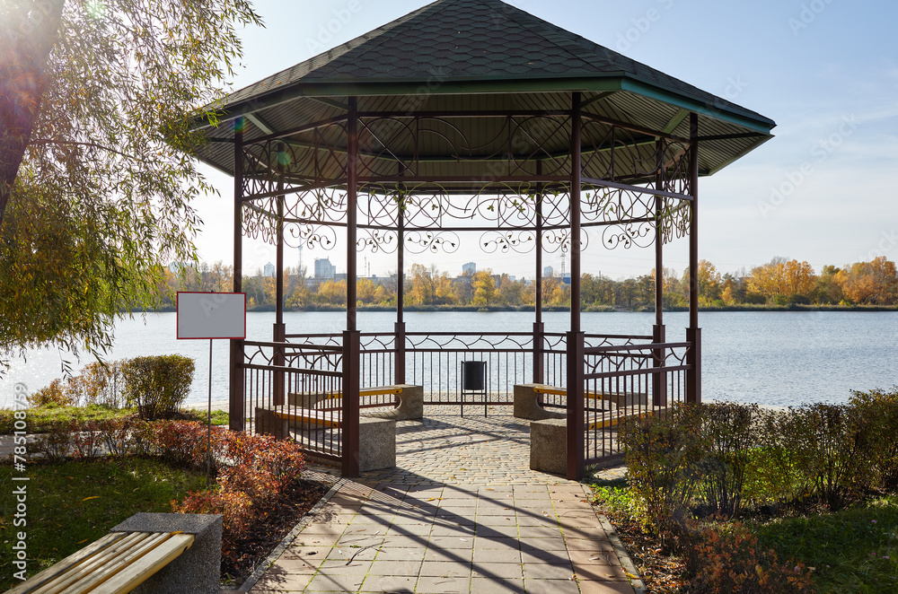 Rest area with bench in Kyiv, Europe. Place to rest in the city park. Rotunda or gazebo on the river embankment Rest area with bench in Kyiv, Europe. Place to rest in the city park. Rotunda or gazebo on the river embankment