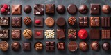 An assortment of delicious chocolates arranged on a dark marble background.
