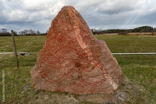 Stockholm, Sweden An ancient rune stone from the Viking era in thr Taby district. photo