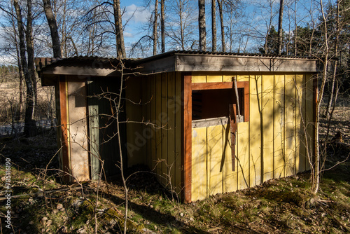 Stockholm, Sweden An abandoned and crumbling  wooden shack in the woods. photo