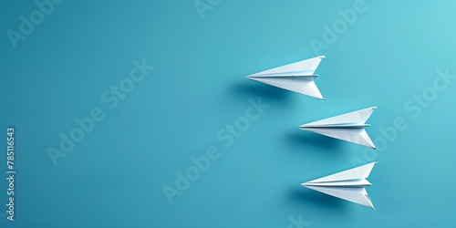 Three paper planes are flying in a blue sky. The planes are all white and have different sizes. The smallest plane is in the front, the medium plane is in the middle photo