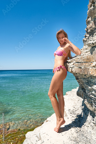 Bright portrait of a young woman at the beach of Black sea