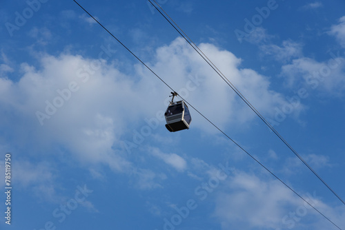 funicular cabin against the background of clouds and bright blue sky. selective focus . High quality photo