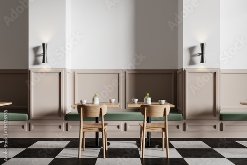 White and beige minimalistic checkered floor cafe interior with sofa and tables