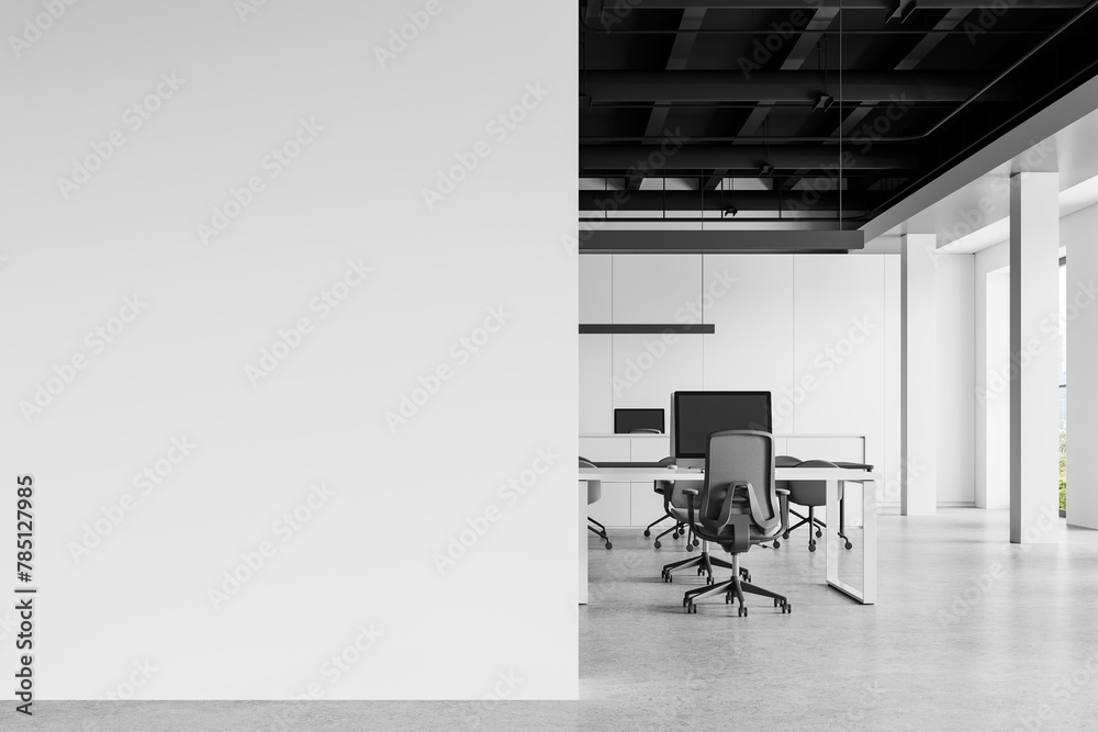 Obraz premium White coworking interior with pc computers in row, panoramic window. Mockup wall