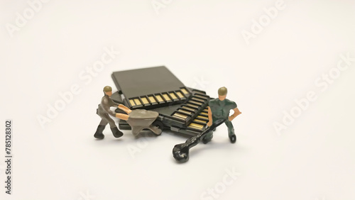 Miniature workers transferring memory cards